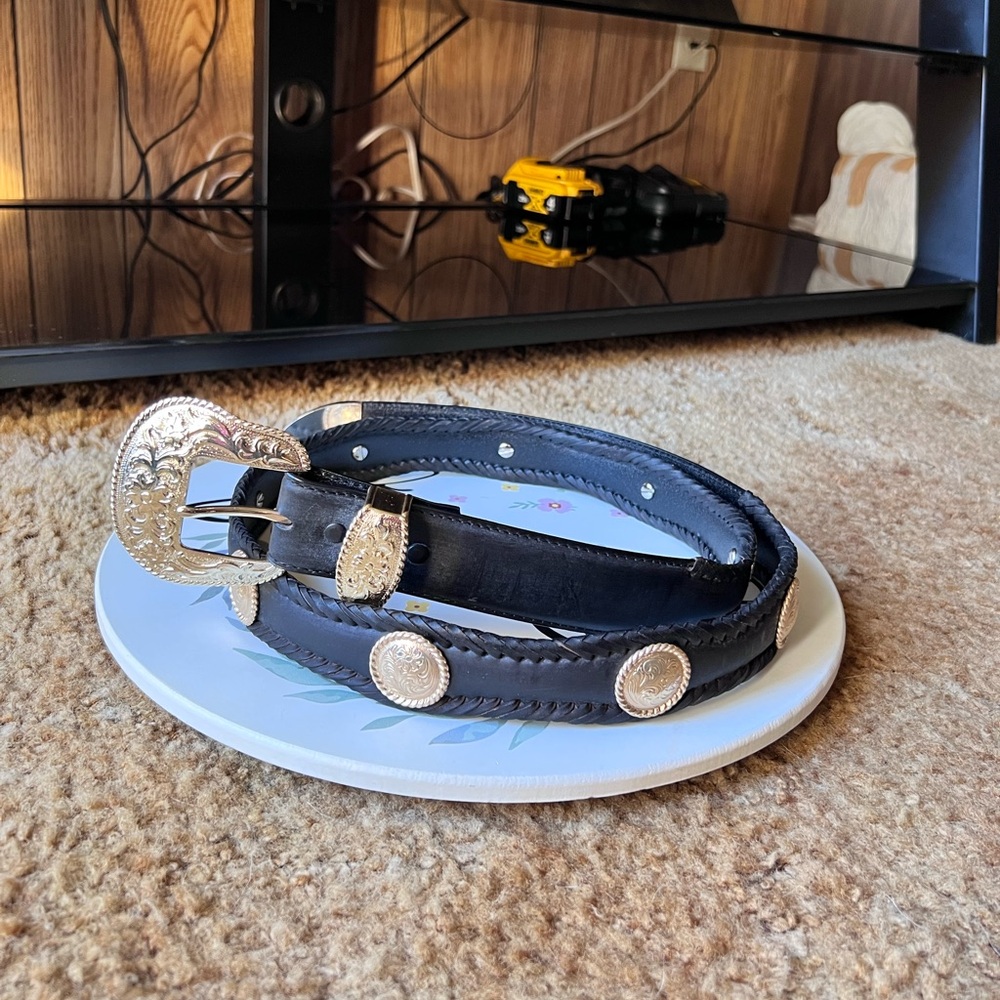 Women’s genuine black leather western belt with a gold-toned buckle and conchos.